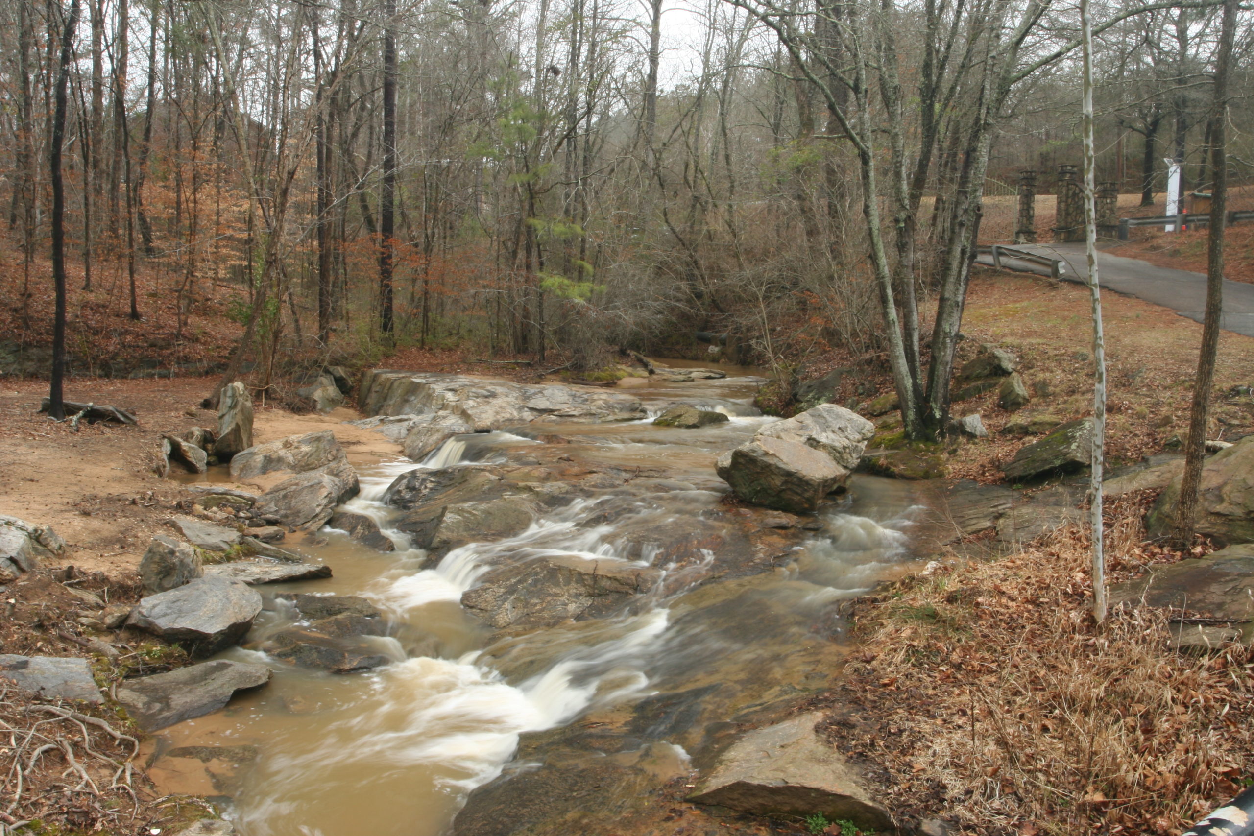 high flow stream adjacent to road